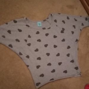 A shirt/sweater with hearts and quarter sleeves